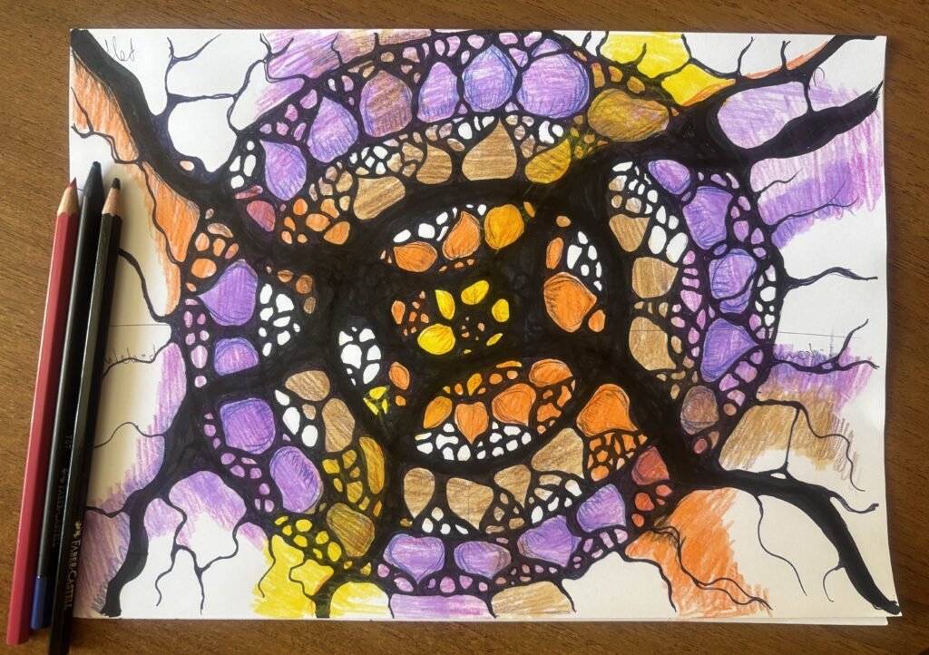 NeuroLotus. A spiral-patterned Neurographica piece with layers of purple, orange, brown, and yellow shapes encircled by black lines. The composition feels like an energetic vortex, with pencils placed on the wooden table as part of the workspace.