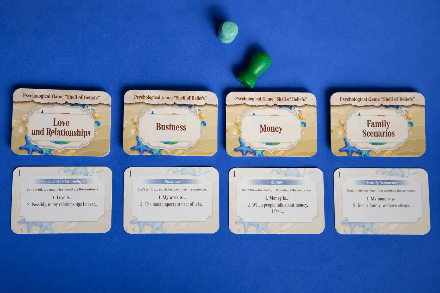Shell of Beliefs psychological game cover featuring seashells, starfish and a colorful spiral design.