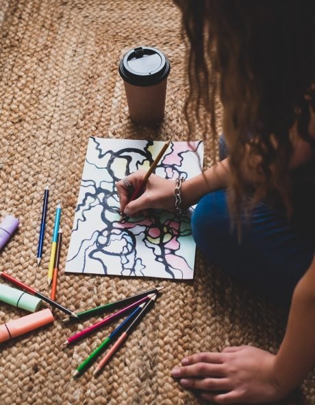 neurographics-the-method-of-mental-health-visual-2022-10-31-03-05-29-utc-min Person focused on drawing neurographic art, creating intricate lines and colorful shapes.
